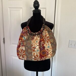 Chateau bohemian cloth shoulder bag with wooden beaded handle.